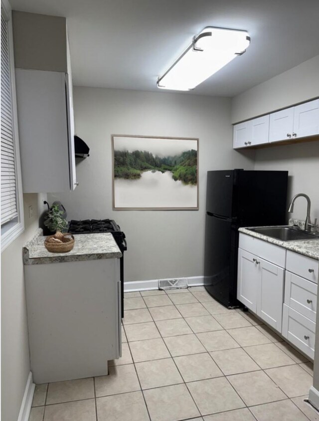 2057 Pine St, Des Plaines, IL 60018 - kitchen featuring a sink, freestanding refrigerator, baseboards, light tile patterned floors, and visible vents