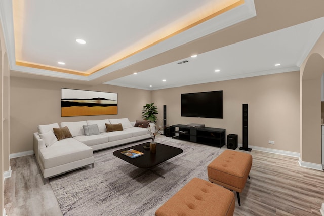 1574 Farmside Ln, Bolingbrook, IL 60490 - living area featuring crown molding, a tray ceiling, baseboards, and light wood-style floors