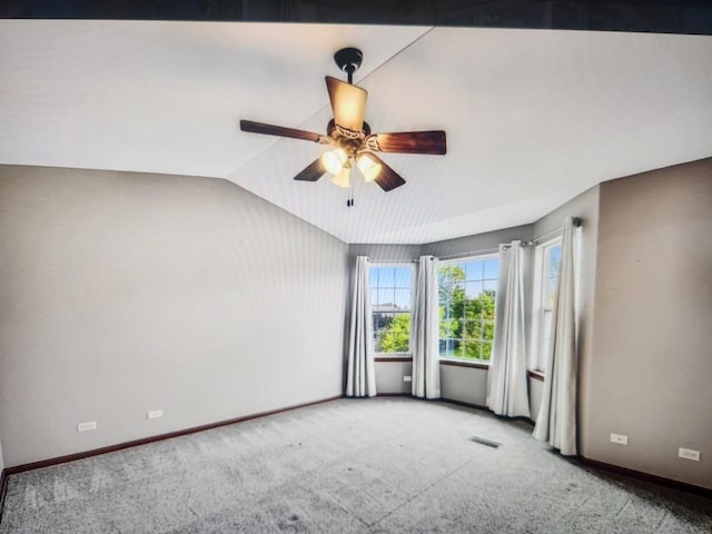 1208 Fox Hill Ln, North Aurora, IL 60542 - carpeted empty room with visible vents, baseboards, a ceiling fan, and vaulted ceiling