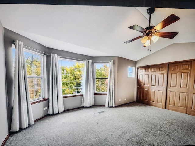 1208 Fox Hill Ln, North Aurora, IL 60542 - unfurnished bedroom with baseboards, lofted ceiling, and carpet