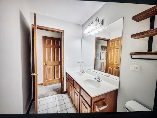 1208 Fox Hill Ln, North Aurora, IL 60542 - bathroom featuring a sink, toilet, double vanity, and tile patterned flooring