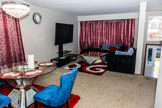 1208 Fox Hill Ln, North Aurora, IL 60542 - carpeted dining room featuring a notable chandelier