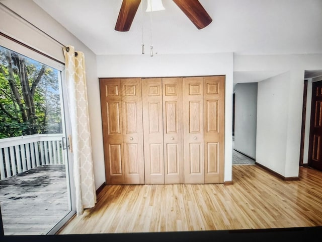 1208 Fox Hill Ln, North Aurora, IL 60542 - unfurnished bedroom featuring a closet, light wood-style floors, baseboards, and a ceiling fan