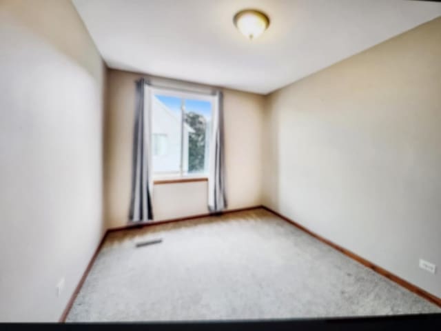1208 Fox Hill Ln, North Aurora, IL 60542 - empty room with baseboards and carpet flooring