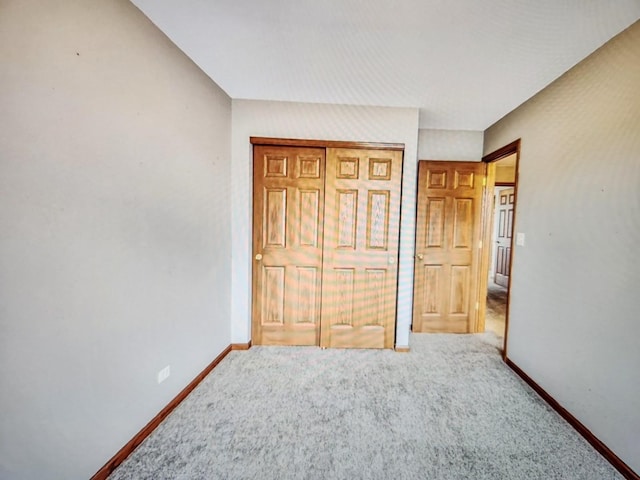 1208 Fox Hill Ln, North Aurora, IL 60542 - unfurnished bedroom with a closet, carpet, and baseboards