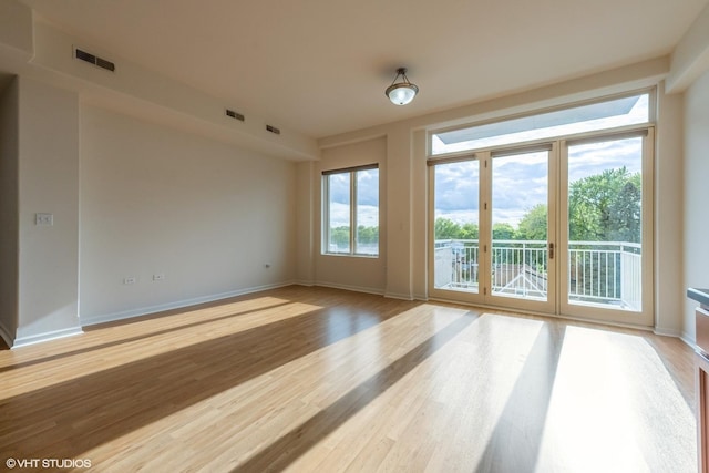 3630 N Harlem Ave Unit 410, Chicago, IL 60634 - unfurnished room featuring light wood finished floors and baseboards