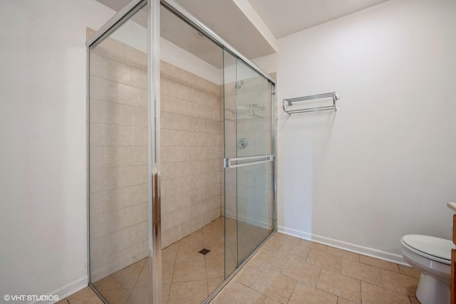 3630 N Harlem Ave Unit 410, Chicago, IL 60634 - full bathroom featuring toilet, a shower stall, and baseboards
