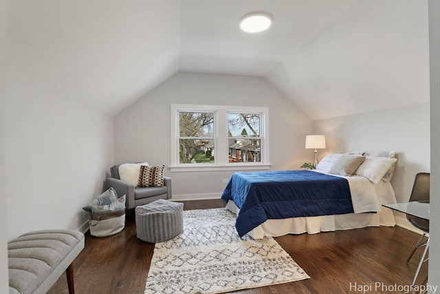 bedroom featuring vaulted ceiling and wood finished floors