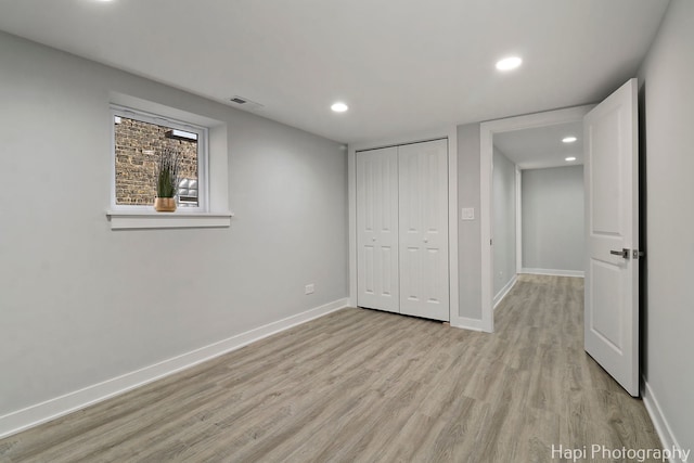 unfurnished bedroom featuring baseboards, light wood-style flooring, visible vents, and recessed lighting
