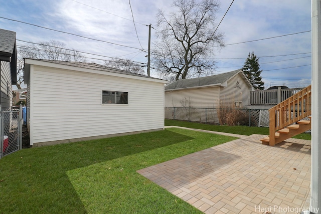 view of yard featuring a fenced backyard, stairs, and a patio