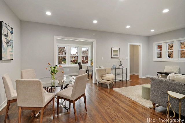 dining space with recessed lighting, dark wood finished floors, and baseboards