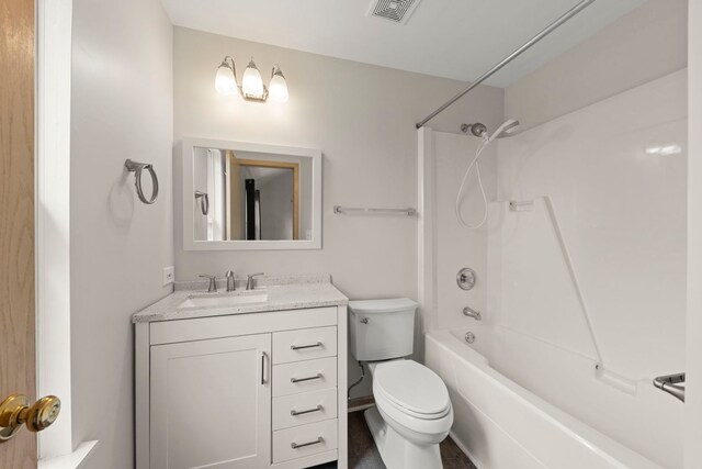 full bathroom with vanity, toilet, visible vents, and bathtub / shower combination