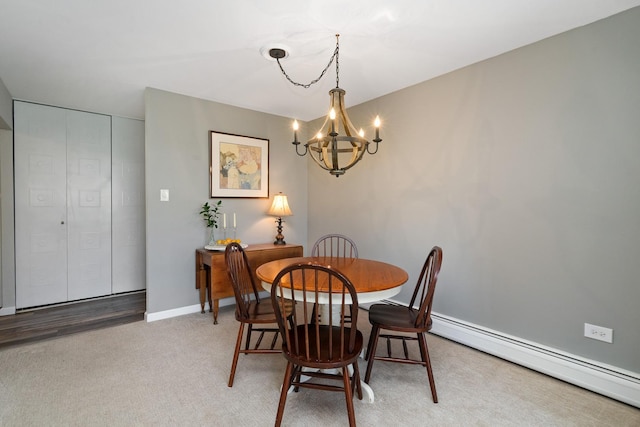 4248 Saratoga Ave Unit K102, Downers Grove, IL 60515 - dining area featuring a baseboard radiator, a chandelier, and baseboards