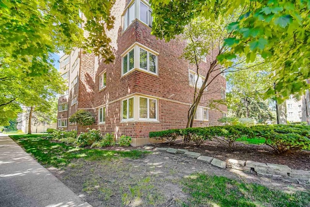 view of home's exterior featuring brick siding