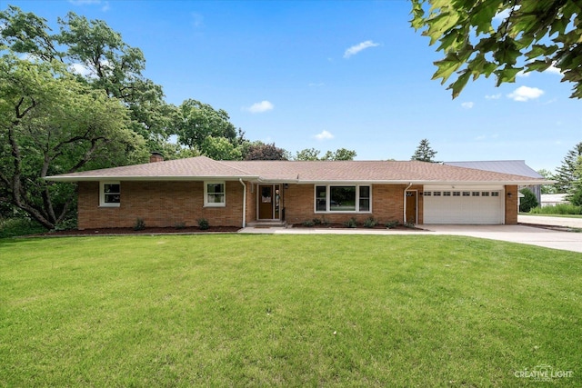 12N988 Engel Rd, Sycamore, IL 60178 - ranch-style home with an attached garage, concrete driveway, a front lawn, and brick siding