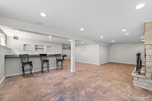 12N988 Engel Rd, Sycamore, IL 60178 - finished below grade area featuring baseboards, a bar, and recessed lighting