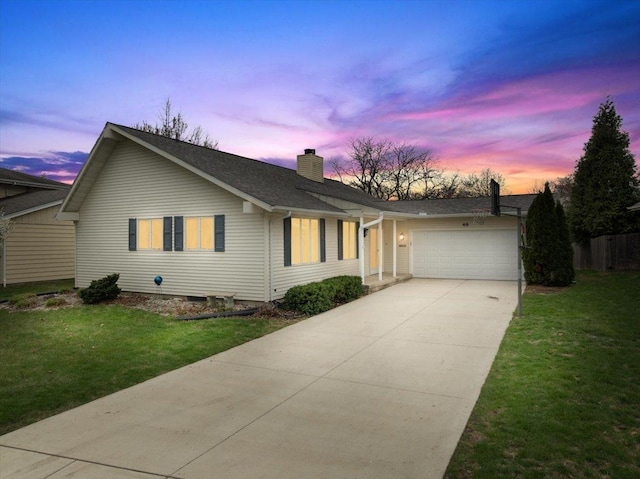 single story home featuring a garage, a yard, driveway, and a chimney