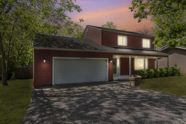 22315 W Terry Dr N, Lake Villa, IL 60046 - view of front of home with asphalt driveway, covered porch, and a garage
