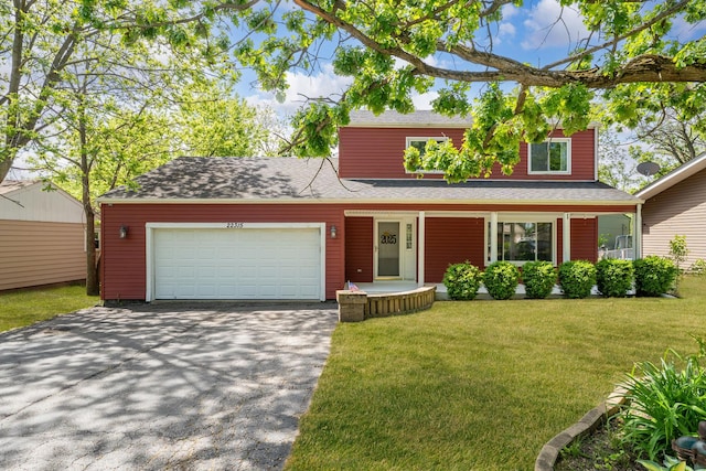 22315 W Terry Dr N, Lake Villa, IL 60046 - traditional-style home with a garage, driveway, a front yard, and a porch