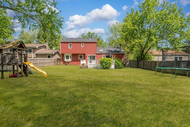 22315 W Terry Dr N, Lake Villa, IL 60046 - view of yard with a trampoline, a playground, and a wooden deck