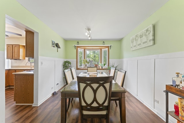 22315 W Terry Dr N, Lake Villa, IL 60046 - dining room featuring dark wood-type flooring, a decorative wall, and wainscoting