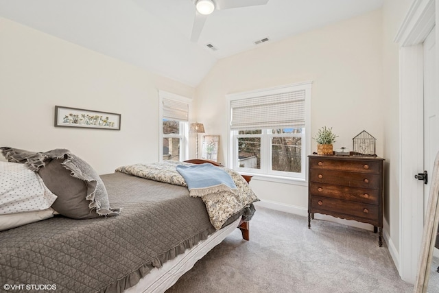 bedroom with carpet, visible vents, baseboards, and vaulted ceiling