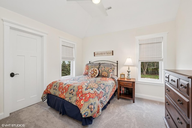 bedroom featuring baseboards, lofted ceiling, visible vents, and carpet floors