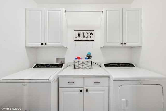laundry room featuring cabinet space and washing machine and clothes dryer