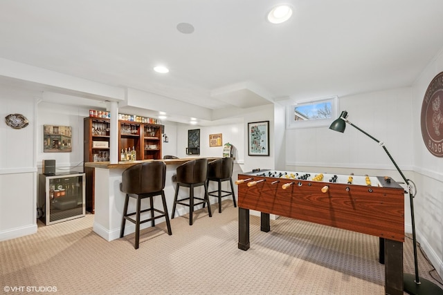 playroom featuring wet bar, recessed lighting, beverage cooler, and light carpet
