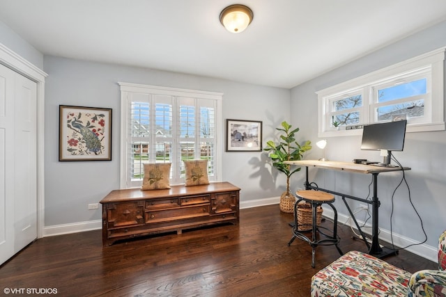 office area featuring baseboards and wood finished floors