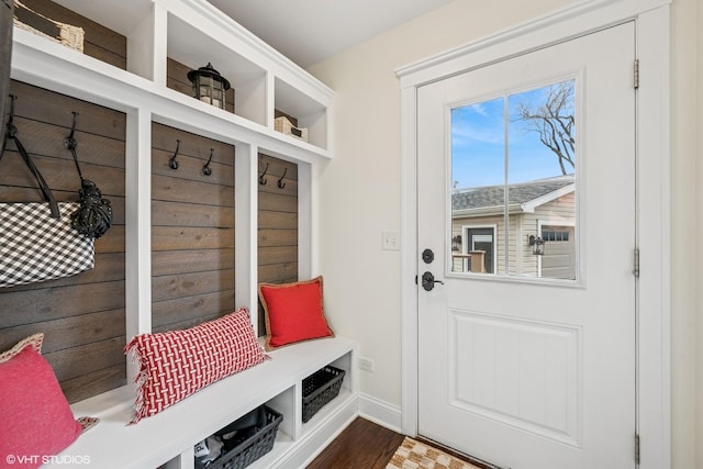 mudroom featuring baseboards and wood finished floors