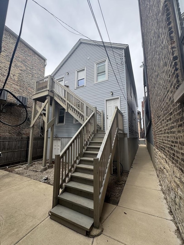 1516 W 18th Pl, Chicago, IL 60608 - rear view of property with a patio area, fence, a wooden deck, and stairway