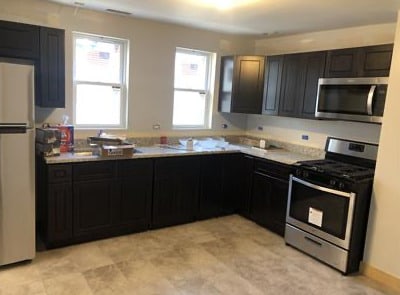 1516 W 18th Pl, Chicago, IL 60608 - kitchen featuring light countertops and appliances with stainless steel finishes