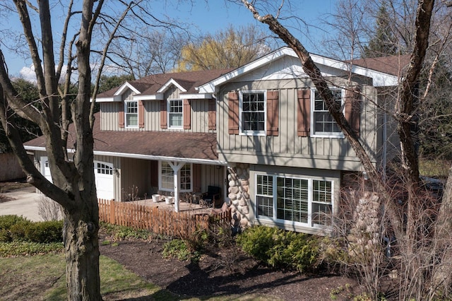 1336 Christina Ln, Northbrook, IL 60062 - traditional-style home featuring board and batten siding, a porch, and a garage