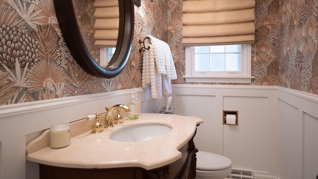 1336 Christina Ln, Northbrook, IL 60062 - half bathroom with a decorative wall, vanity, a wainscoted wall, toilet, and wallpapered walls