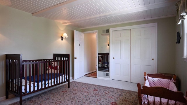 1336 Christina Ln, Northbrook, IL 60062 - carpeted bedroom with visible vents, wood ceiling, a closet, and beamed ceiling