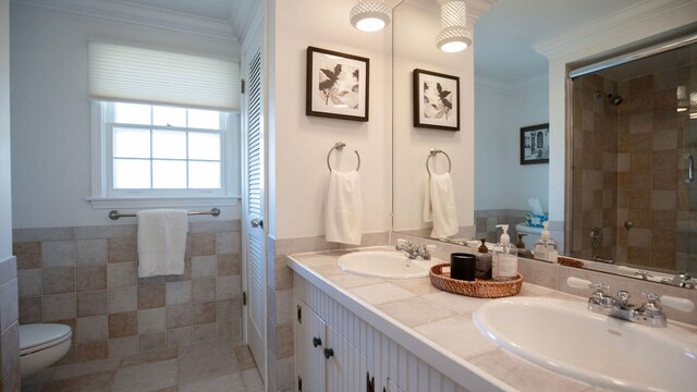 1336 Christina Ln, Northbrook, IL 60062 - bathroom with a tile shower, tile walls, a sink, and toilet
