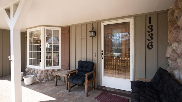 1336 Christina Ln, Northbrook, IL 60062 - doorway to property featuring board and batten siding and stone siding