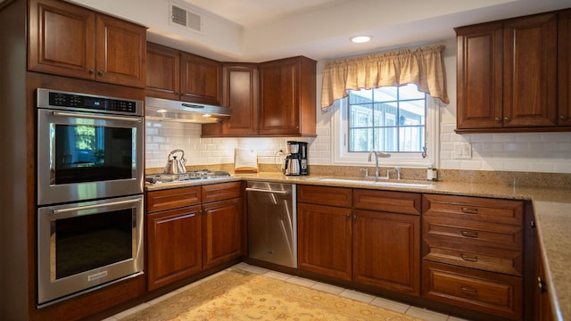 1336 Christina Ln, Northbrook, IL 60062 - kitchen with light tile patterned floors, under cabinet range hood, visible vents, appliances with stainless steel finishes, and a sink