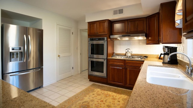 1336 Christina Ln, Northbrook, IL 60062 - kitchen featuring tasteful backsplash, visible vents, appliances with stainless steel finishes, under cabinet range hood, and a sink