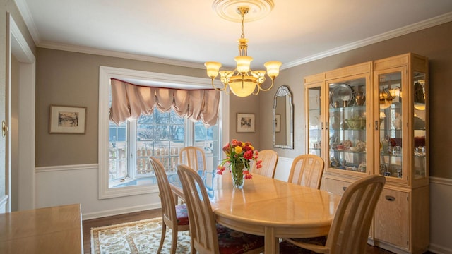 1336 Christina Ln, Northbrook, IL 60062 - dining area featuring a chandelier, dark wood-style flooring, baseboards, and ornamental molding