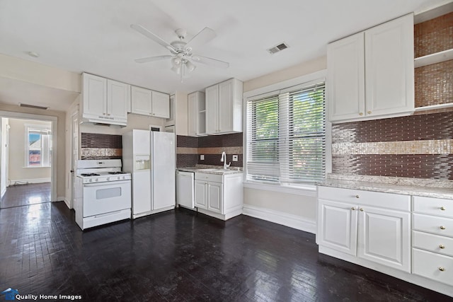2701 W 24th Pl, Chicago, IL 60608 - kitchen with white cabinets, white appliances, a sink, and a ceiling fan