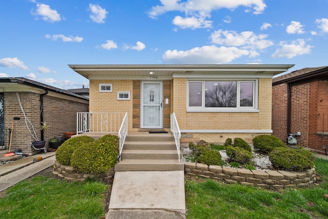 view of front of property featuring brick siding