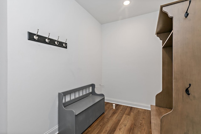 living area with recessed lighting, baseboards, and wood finished floors