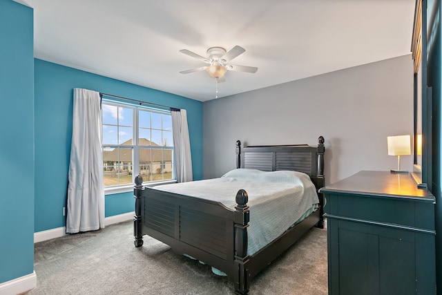 bedroom featuring carpet flooring, a ceiling fan, and baseboards