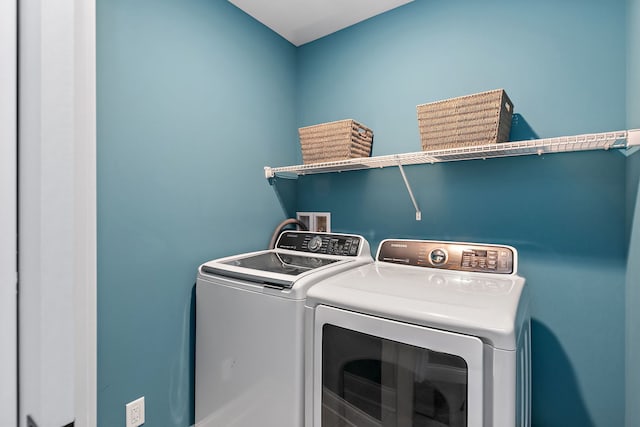 washroom featuring independent washer and dryer and laundry area