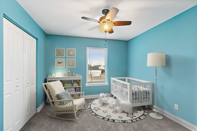 bedroom with a closet, baseboards, and carpet