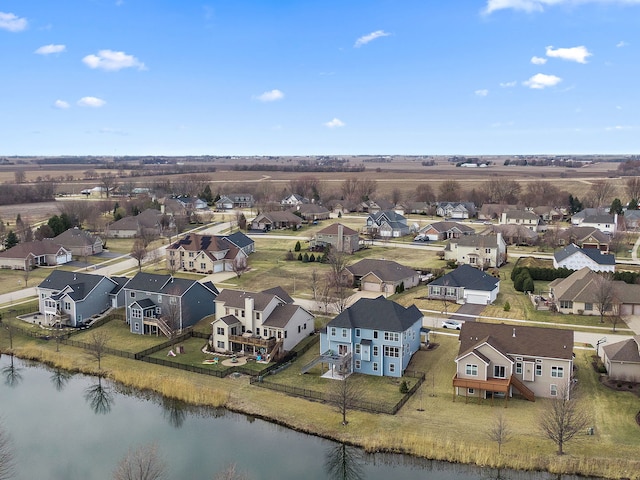 bird's eye view with a water view and a residential view
