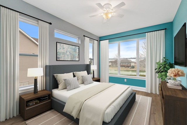 bedroom featuring wood finished floors and ceiling fan