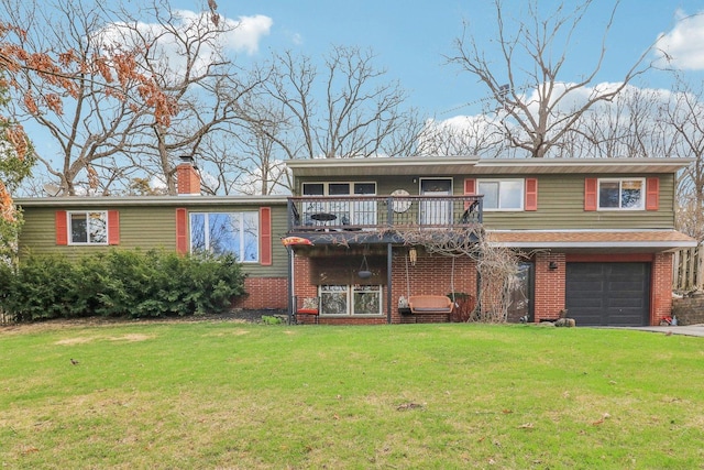 view of front of house with a garage, a front yard, driveway, and brick siding
